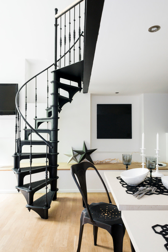 This is an example of a mid-sized contemporary metal spiral staircase in Bordeaux with open risers.