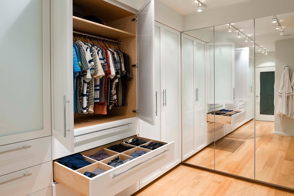 Design ideas for a contemporary walk-in wardrobe in Philadelphia with white cabinets.