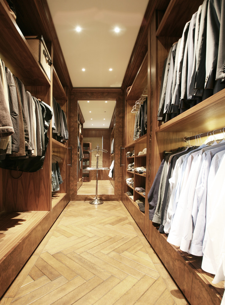 This is an example of a contemporary walk-in wardrobe in London.