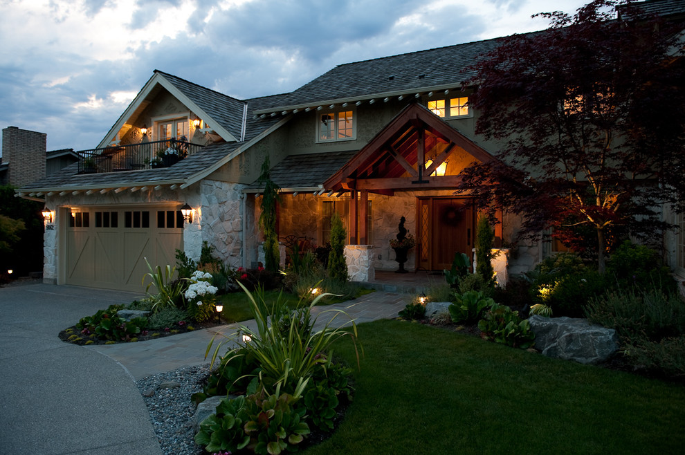 Design ideas for a large traditional two-storey beige exterior in Seattle with stone veneer.