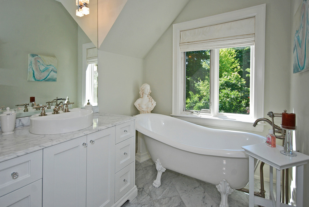 Design ideas for a traditional bathroom in Toronto with a claw-foot tub.