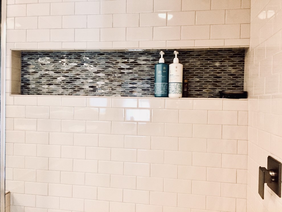 Transitional master multicolored tile and mosaic tile porcelain tile and brown floor freestanding bathtub photo with shaker cabinets, white cabinets, a vessel sink, quartz countertops, a hinged shower door and multicolored countertops