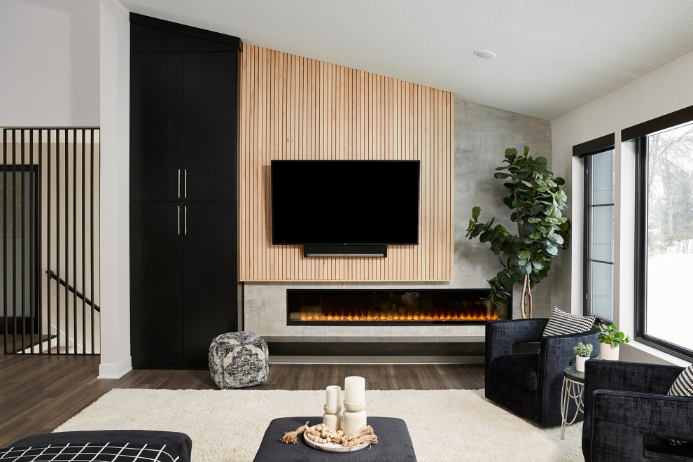 Photo of a large contemporary open concept family room in Minneapolis with grey walls, vinyl floors, a ribbon fireplace, a wall-mounted tv, brown floor and wood walls.