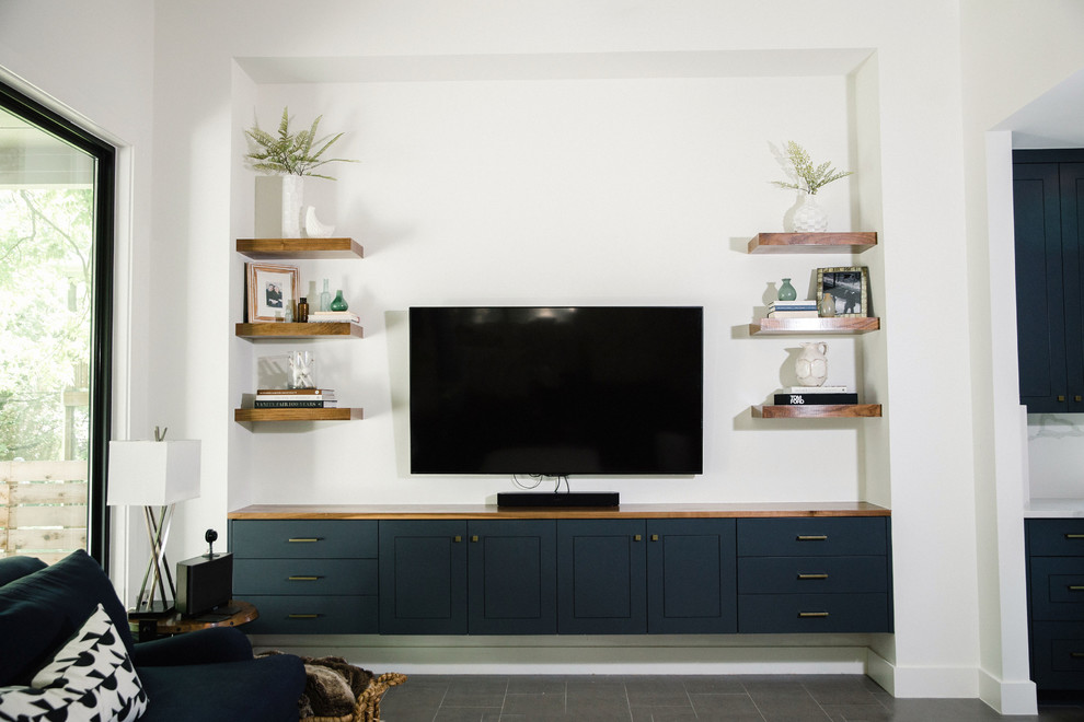 Home design - mid-sized transitional formal and open concept gray floor home design idea in Austin with white walls and a wall-mounted tv