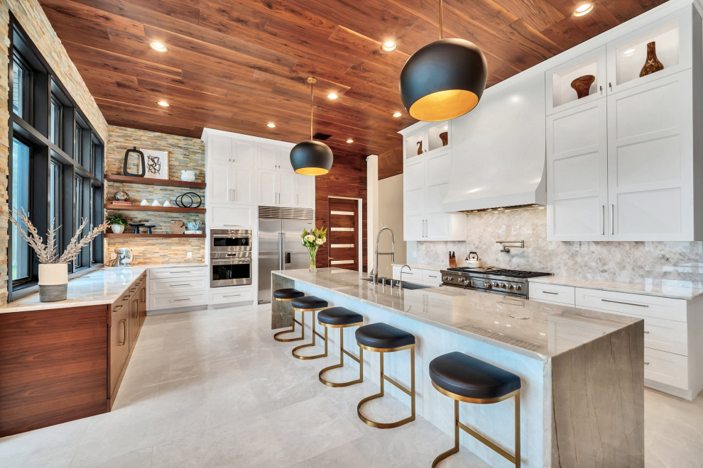 Large transitional u-shaped wood ceiling eat-in kitchen photo in Orlando with a farmhouse sink, shaker cabinets, white cabinets, stainless steel appliances and an island