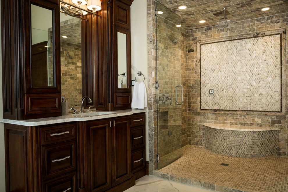 Alcove shower - large transitional master stone tile marble floor alcove shower idea in Austin with recessed-panel cabinets, dark wood cabinets, white walls, an undermount sink and marble countertops