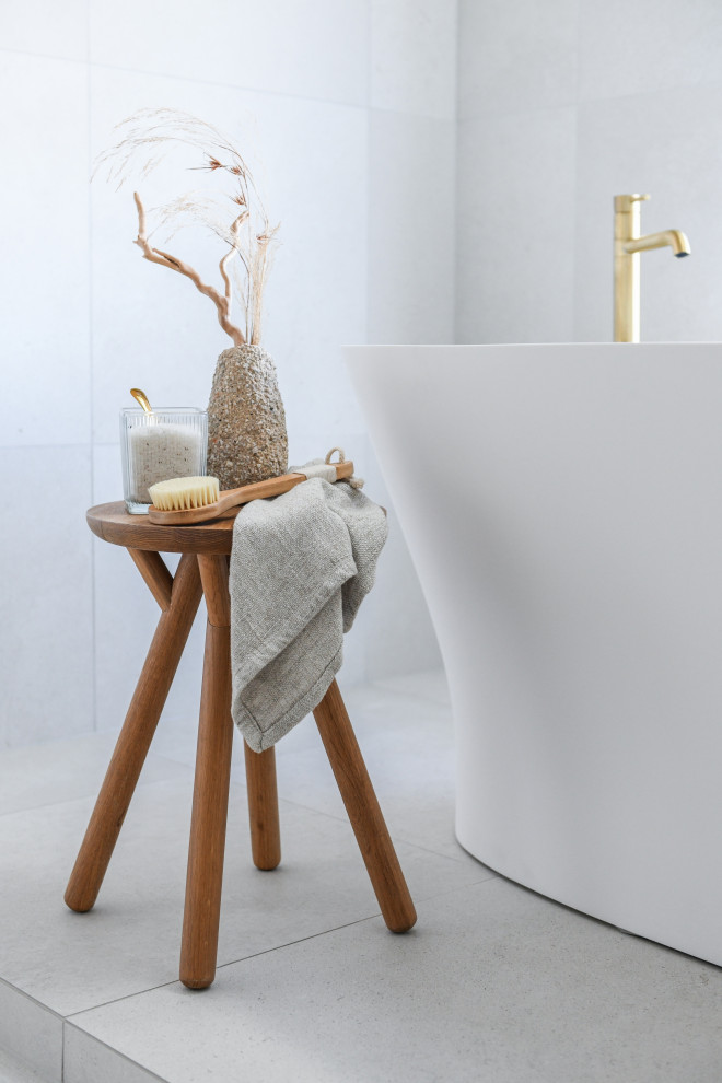 Design ideas for an expansive beach style master bathroom in Sydney with medium wood cabinets, a freestanding tub, a double shower, a wall-mount toilet, yellow tile, porcelain tile, white walls, porcelain floors, a drop-in sink, engineered quartz benchtops, white floor, an open shower, a niche, a double vanity and a floating vanity.