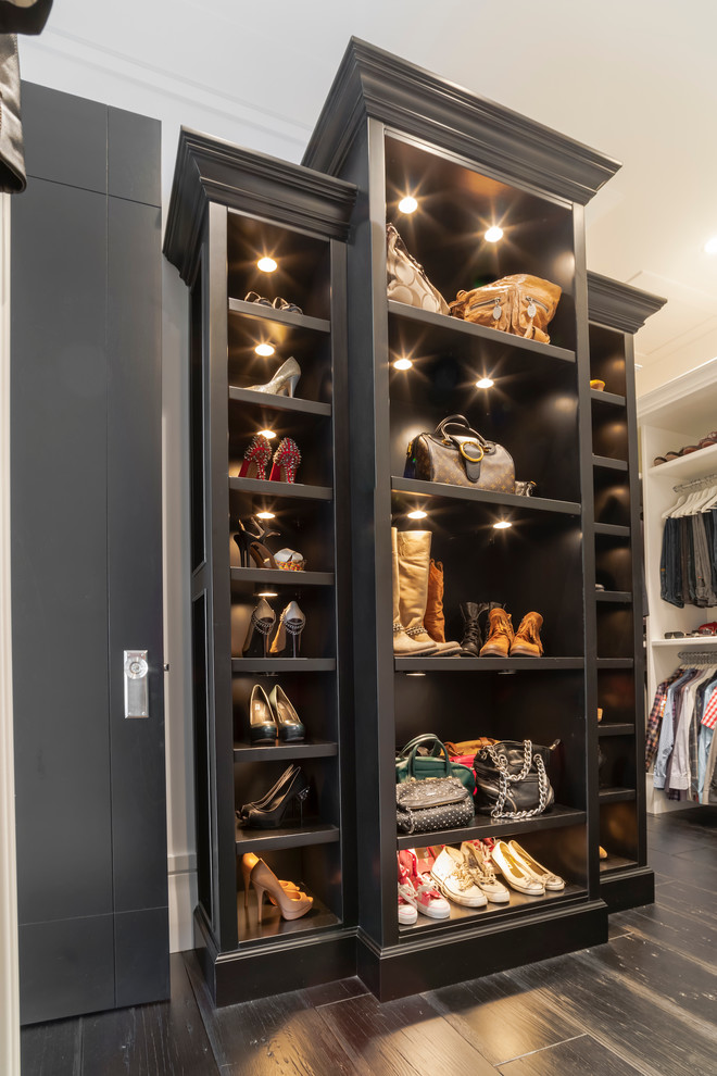 Design ideas for a transitional storage and wardrobe in Edmonton with black cabinets.