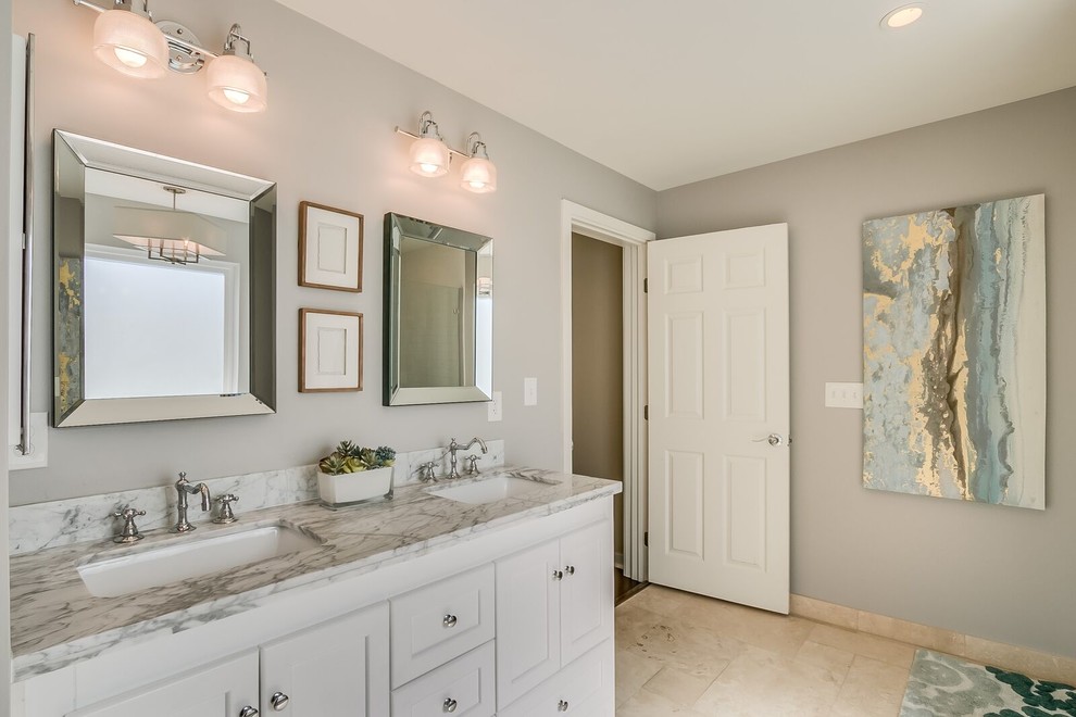 Inspiration for a large transitional porcelain tile and beige floor bathroom remodel in Phoenix with recessed-panel cabinets, white cabinets, beige walls, an undermount sink and marble countertops