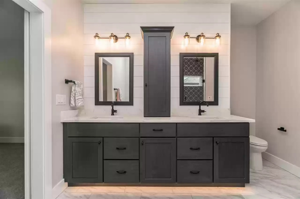 Mid-sized modern master bathroom in Cedar Rapids with shaker cabinets, dark wood cabinets, a one-piece toilet, white tile, grey walls, ceramic floors, marble benchtops, white floor, white benchtops, a double vanity, a built-in vanity and planked wall panelling.