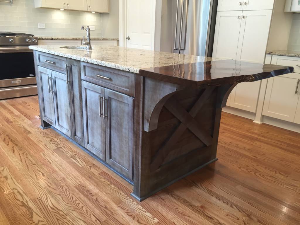 Custom island with granite top and "live edge" at seating area