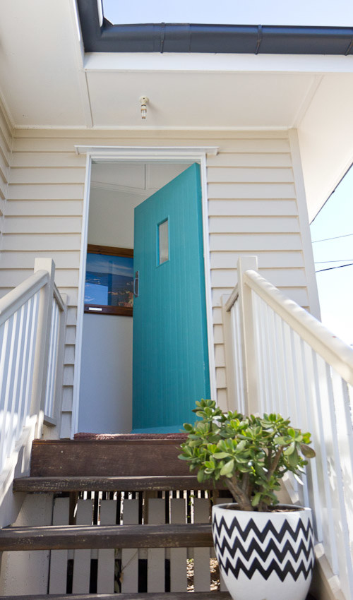 Photo of a beach style entryway in Brisbane.