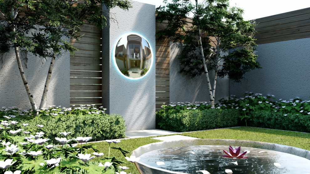 Esempio di un piccolo giardino minimalista esposto a mezz'ombra dietro casa in estate con pavimentazioni in pietra naturale e recinzione in legno