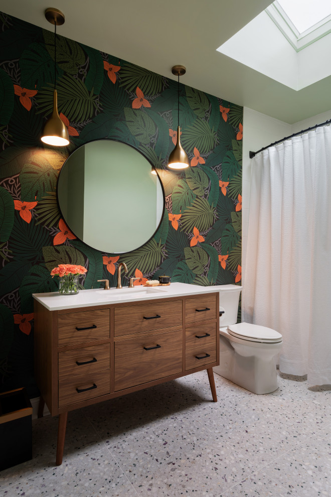 This is an example of a contemporary bathroom in Philadelphia with flat-panel cabinets, a shower/bathtub combo, green walls, a shower curtain, white benchtops, a single vanity, a freestanding vanity and wallpaper.