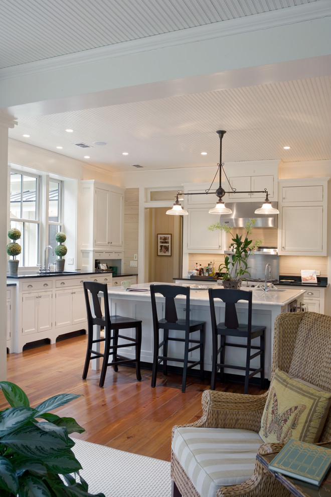 Inspiration for a traditional open plan kitchen in Atlanta with white cabinets.