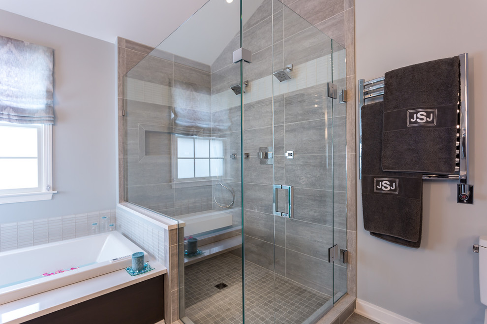 Design ideas for a large modern master bathroom in New York with an undermount sink, flat-panel cabinets, dark wood cabinets, engineered quartz benchtops, a drop-in tub, a double shower, a one-piece toilet, gray tile, porcelain tile, blue walls and porcelain floors.