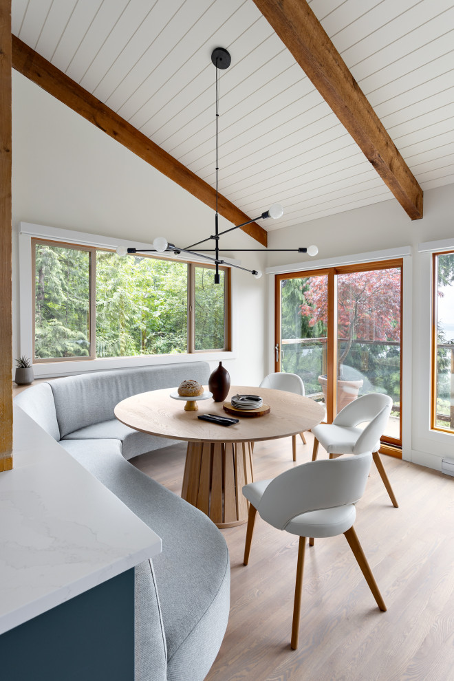 Mid-sized trendy exposed beam, shiplap ceiling, vaulted ceiling, light wood floor and beige floor kitchen/dining room combo photo in Vancouver with white walls and no fireplace
