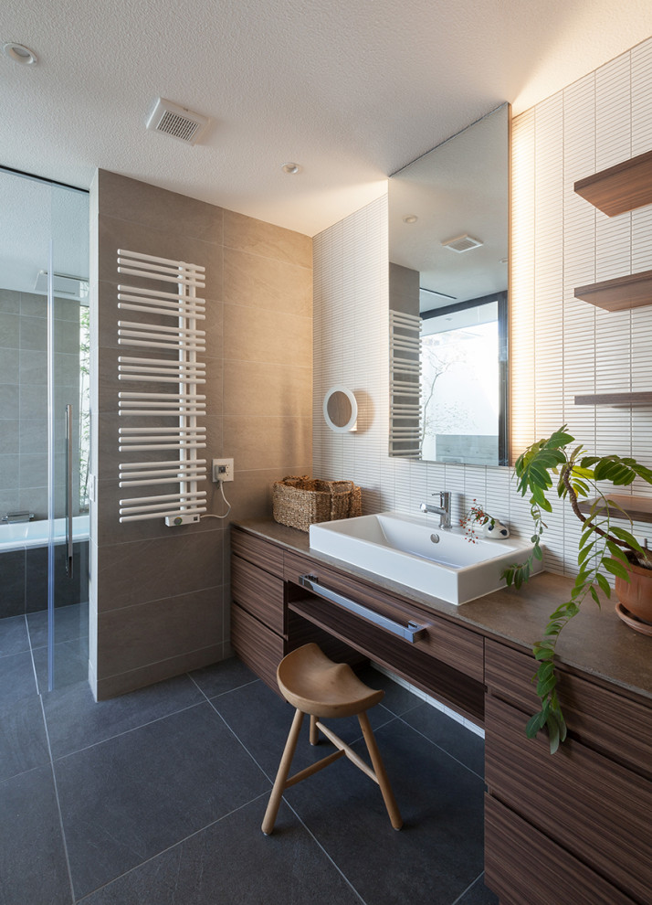 This is an example of a contemporary bathroom in Nagoya with flat-panel cabinets, dark wood cabinets, white tile, mosaic tile, a vessel sink, grey floor, brown benchtops, a single vanity and a built-in vanity.
