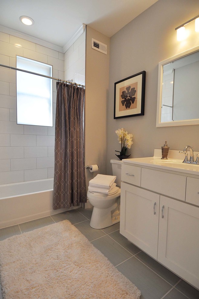 Mid-sized transitional kids' white tile and ceramic tile medium tone wood floor tub/shower combo photo in St Louis with shaker cabinets, white cabinets and gray walls