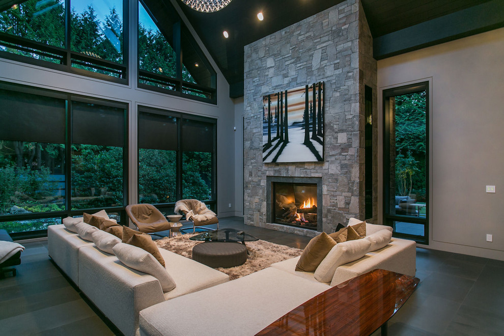 Inspiration for a contemporary formal open concept living room in Vancouver with grey walls, slate floors, a standard fireplace, a stone fireplace surround and no tv.