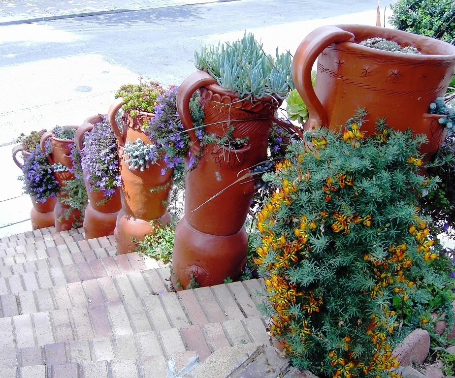 Front Yard with Artistic Driveway, Custom Sculptures, Planted Walls