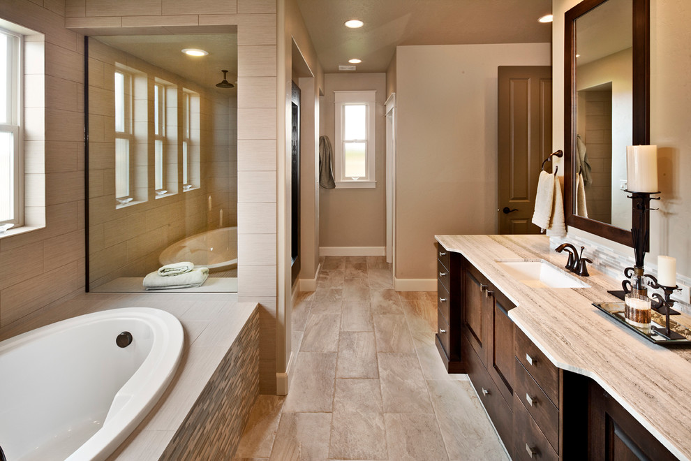 Design ideas for a contemporary bathroom in Boise with a drop-in tub and matchstick tile.