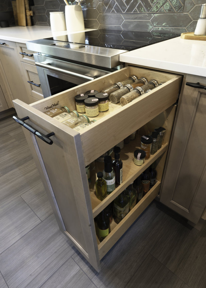 Inspiration for a large transitional eat-in kitchen remodel in Chicago with recessed-panel cabinets, light wood cabinets, quartz countertops, gray backsplash, porcelain backsplash, an island and white countertops