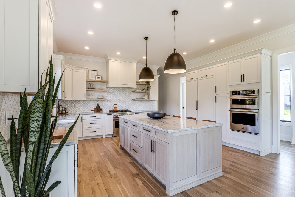 Example of a transitional kitchen design in Denver