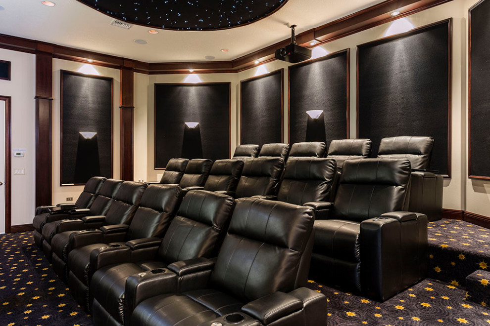 Photo of an expansive transitional enclosed home theatre in Orlando with a wall-mounted tv, beige walls, carpet and black floor.