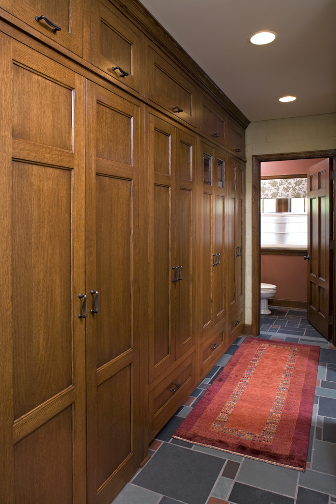 This is an example of a traditional hallway in Minneapolis with beige walls and multi-coloured floor.