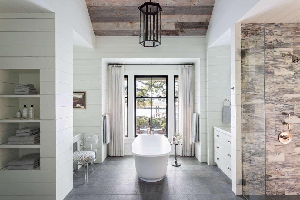 Inspiration for a beach style master bathroom in Charleston with white cabinets, a freestanding tub, an open shower, white walls, marble floors, an undermount sink, marble benchtops, pink floor, an open shower and white benchtops.