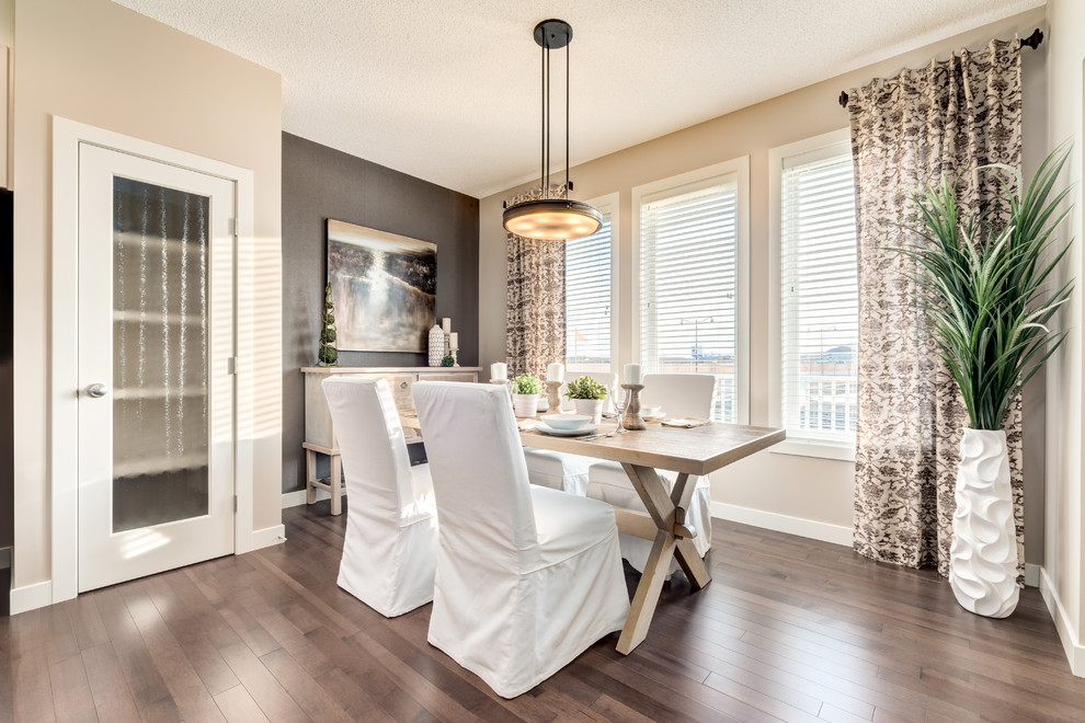 Contemporary dining room in Calgary with grey walls and dark hardwood floors.