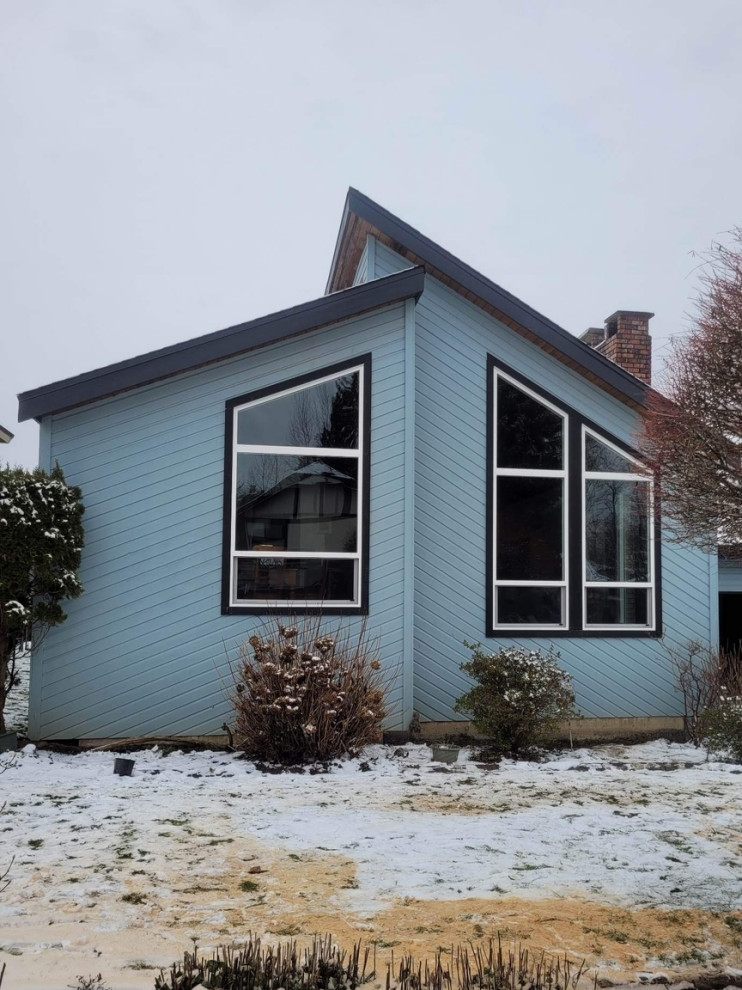 Mid-sized 1960s two-story house exterior photo in Other