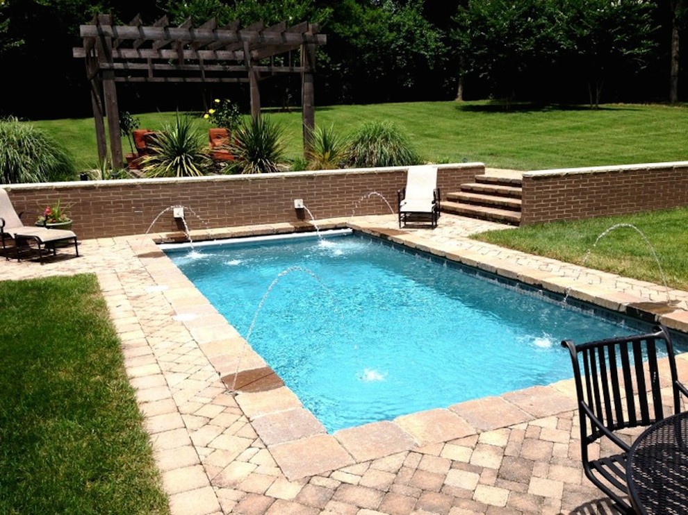 Pool fountain - small transitional backyard concrete paver and rectangular pool fountain idea in Nashville