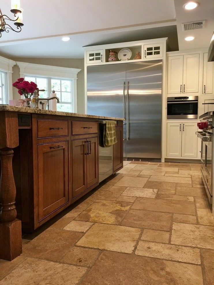 Example of a transitional kitchen design in Minneapolis with recessed-panel cabinets, white cabinets, granite countertops and beige backsplash