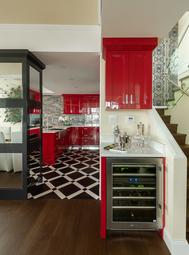 Photo of a small transitional single-wall home bar in Vancouver with red cabinets, quartz benchtops, white benchtop, no sink, recessed-panel cabinets, dark hardwood floors and brown floor.