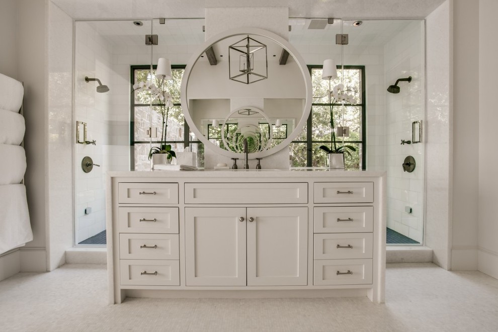 This is an example of a large transitional master bathroom in Dallas with shaker cabinets, white cabinets, a double shower, white tile, white walls and a hinged shower door.