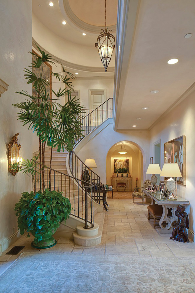 Photo of a large traditional entryway in Los Angeles with ceramic floors.
