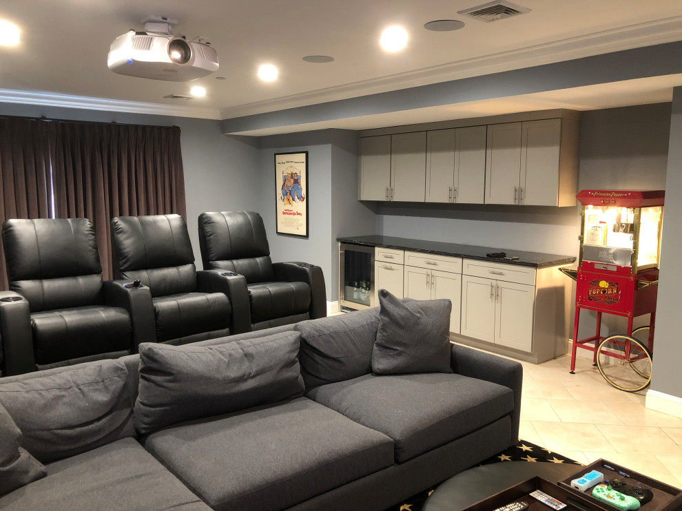 This is an example of a large traditional enclosed home theatre in New York with grey walls, carpet, a projector screen and black floor.