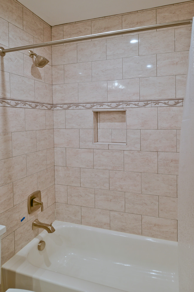 Example of a huge minimalist master beige tile beige floor tub/shower combo design in DC Metro with dark wood cabinets, a hot tub, a one-piece toilet, beige walls, an undermount sink and gray countertops