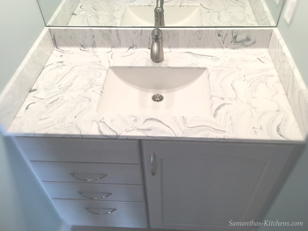 Example of a mid-sized transitional kids' porcelain tile home design design with recessed-panel cabinets, gray cabinets, blue walls, an integrated sink and marble countertops
