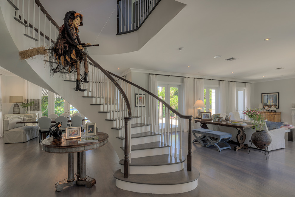 Photo of a transitional wood curved staircase in Miami.