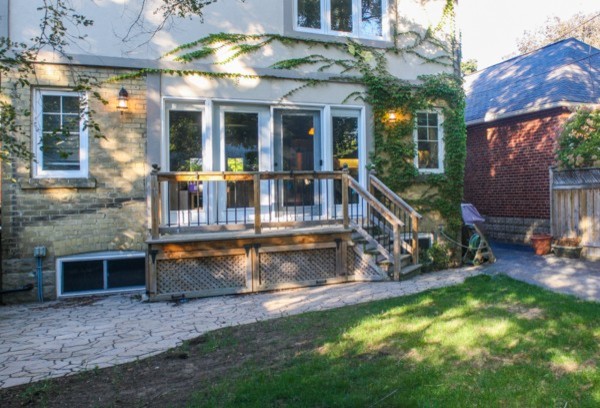 Design ideas for a large backyard partial sun garden in Toronto with brick pavers.