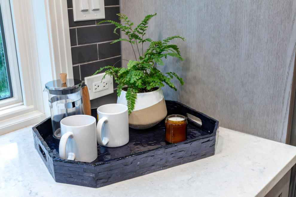 Eat-in kitchen - contemporary u-shaped medium tone wood floor and brown floor eat-in kitchen idea with shaker cabinets, gray cabinets, quartz countertops, gray backsplash, ceramic backsplash, stainless steel appliances, an island, gray countertops and an undermount sink