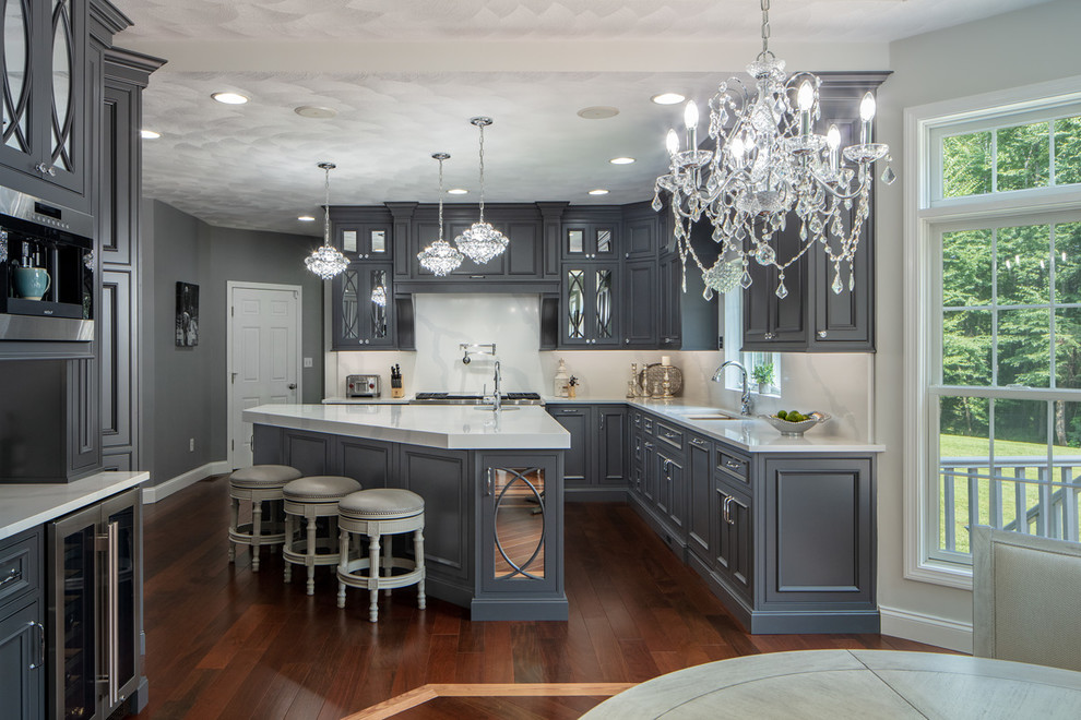 Example of a large classic l-shaped dark wood floor and brown floor eat-in kitchen design in Boston with an undermount sink, beaded inset cabinets, gray cabinets, quartz countertops, stainless steel appliances, an island and white countertops