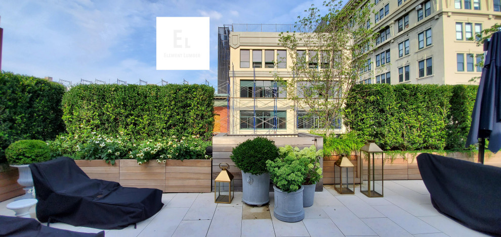 Large contemporary rooftop deck in New York with a container garden and no cover.