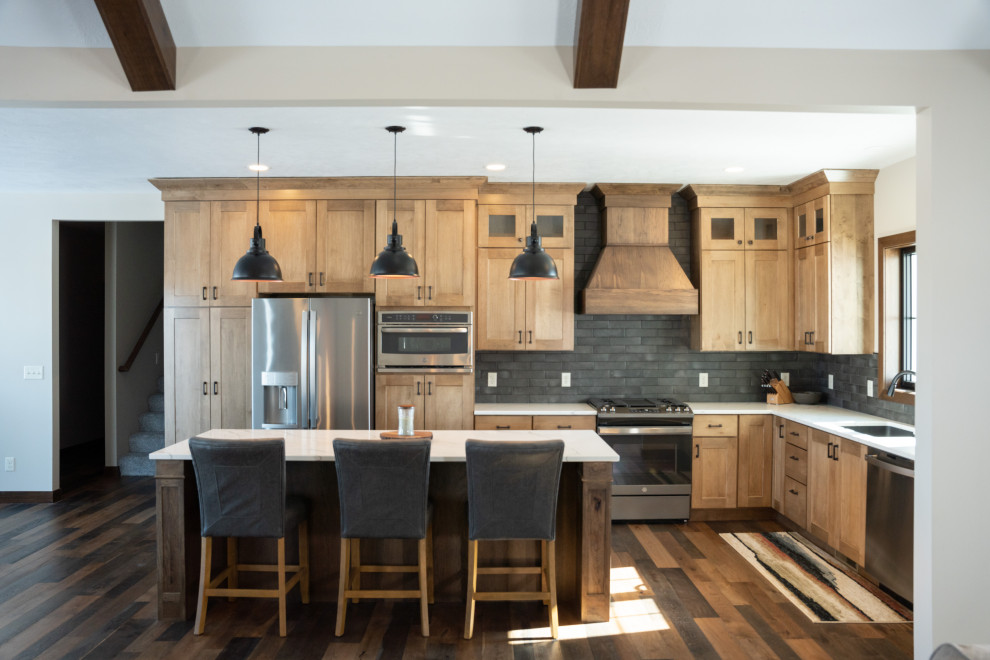Example of a large country u-shaped eat-in kitchen design in Other with shaker cabinets, brown cabinets, stainless steel appliances and an island