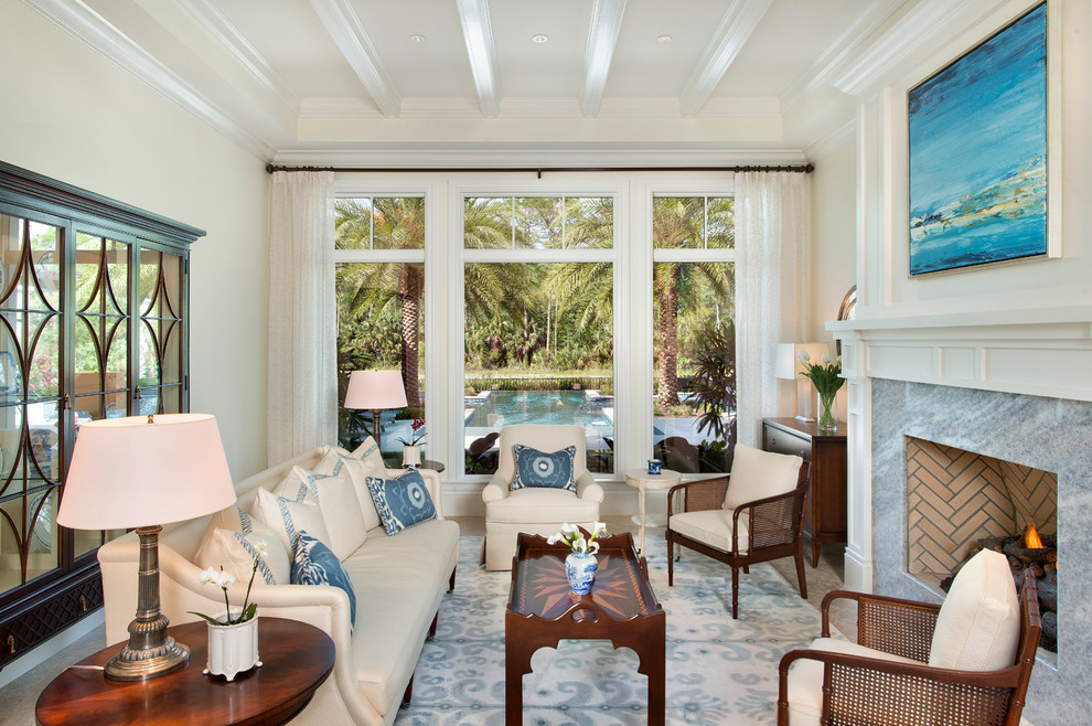 Design ideas for a large tropical formal enclosed living room in Miami with white walls, porcelain floors, a standard fireplace, a stone fireplace surround and no tv.