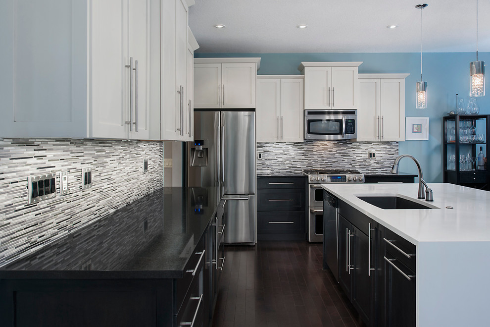 Example of a transitional kitchen design in Calgary