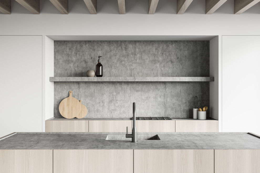 Idéer för stora funkis linjära grått kök, med en integrerad diskho, släta luckor, skåp i ljust trä, bänkskiva i betong, grått stänkskydd och svarta vitvaror